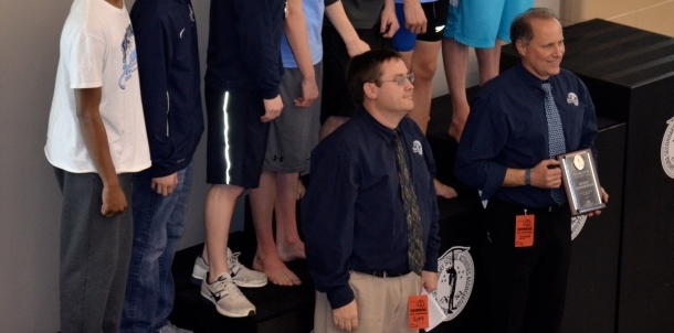 Coach Allen and Coach Harlow on the stand