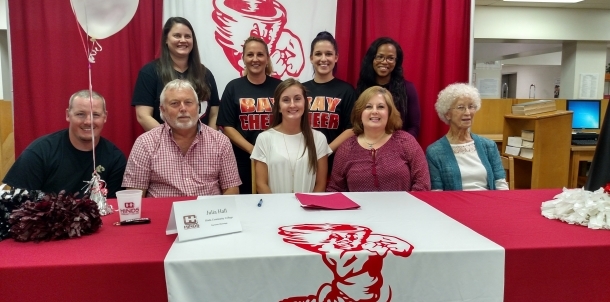 Julia Hall signs cheerleading scholarship