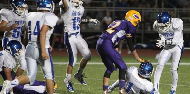 Thomas, behind strong blocking, amasses 303 yards of total offense in Bryant win