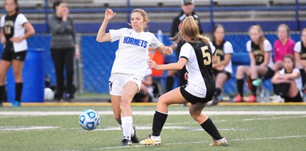 Bryant girls take league leaders to shootout but come up short