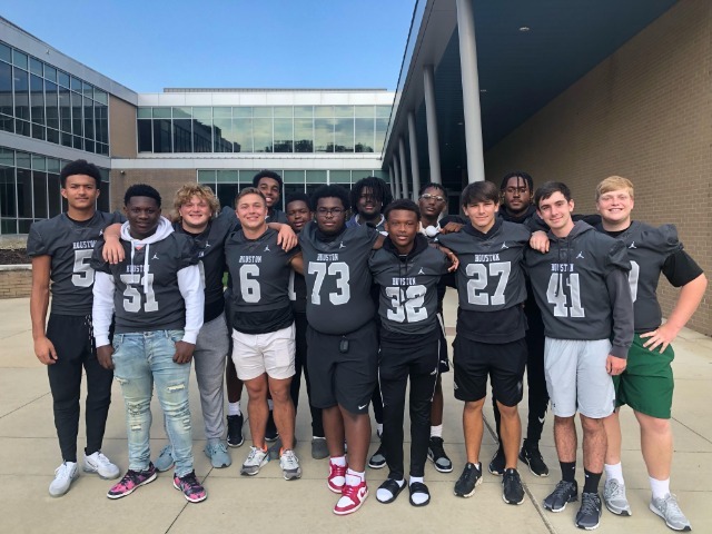 Houston High athletes help with car lines at feeder schools to amp school spirit