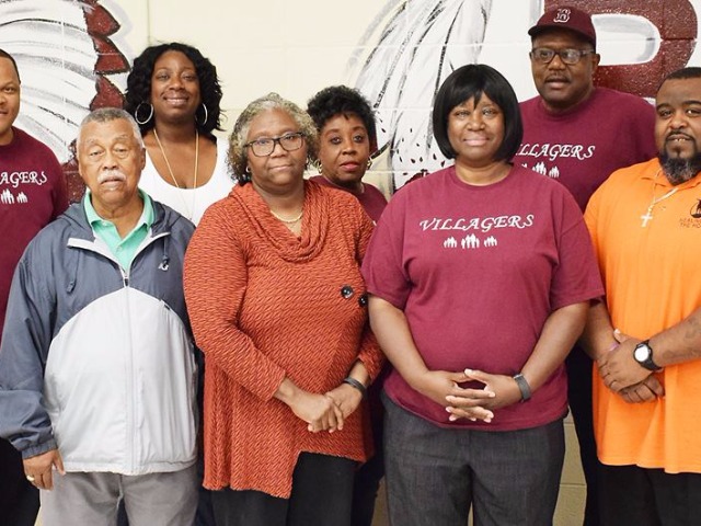 Members of the "Villagers", volunteers and a community group
