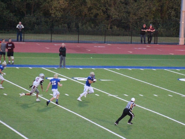 Harrison wins home opener