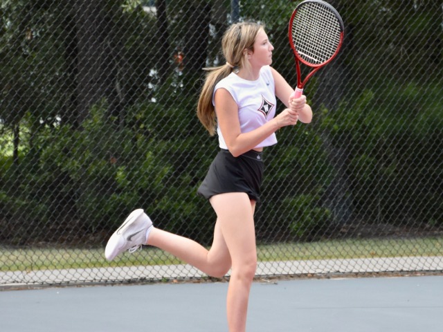 Lilly Biggs crushes a backhand during a recent practice. 