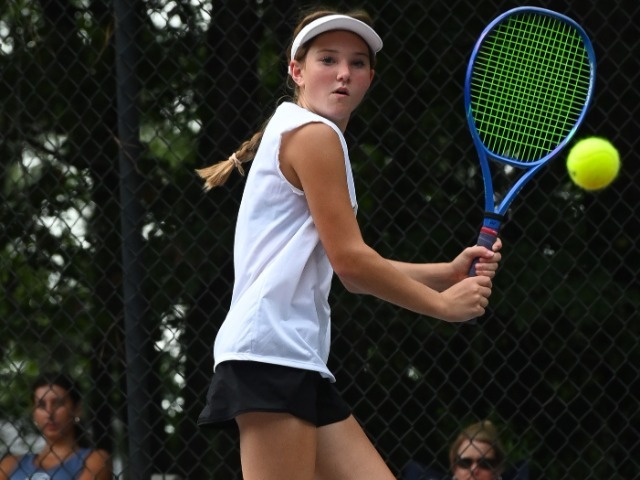 Freshman Caroline Greene, Wando's #4 singles player, prepares to hit a backhand.