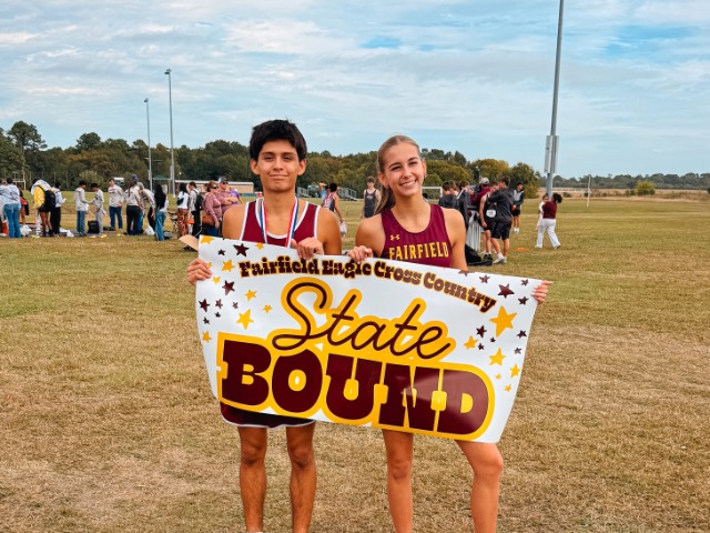 Runners holding state sign