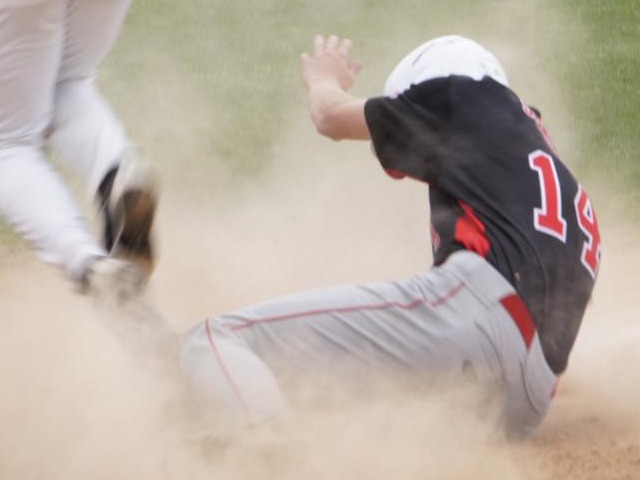 Broncos Battle Through Wet Conditions to Get First District Win Behind Aschenbeck's RBIs