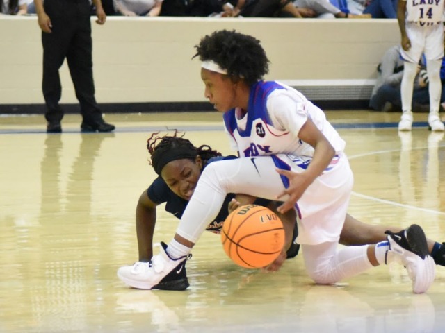 Tucker, defense lead Lady Devils to blowout over Marion