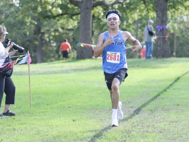 Decatur junior Jose Espinoza races down the stretch of the District 7-4A Championships’ varsity boys 5K race Wednesday at Decatur’s Joe Wheeler Park. 