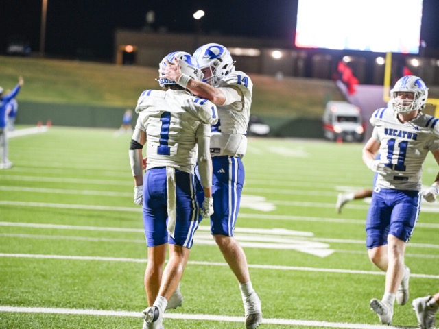Decatur wide receiver Henry Montgomery (1) and quarterback Will Chaney (14) celebrate after a touchdown reception in the Eagles’ 71-64 Week 3 road win