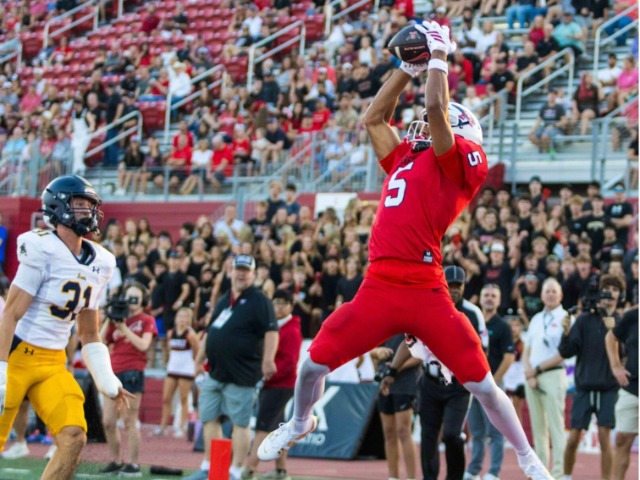 Argyle wide receiver Julian Caldwell leaps to catch a pass in the end zone for a touchdown against Highland Park. Caldwell helped lead the way in a hi