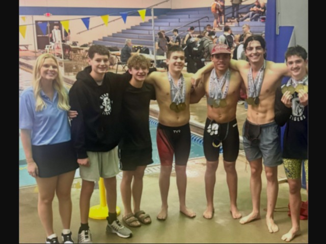  Boys Swim Team Brings Home New Hardware and Records