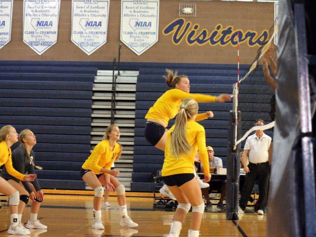 Volleyball starts league play with three-set victory