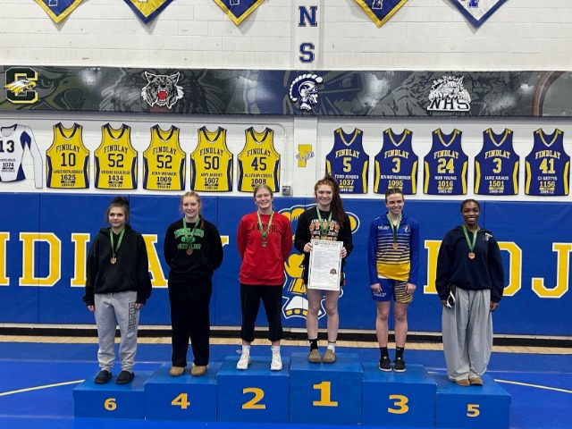 Kelsey on the podium after the girls district tournament