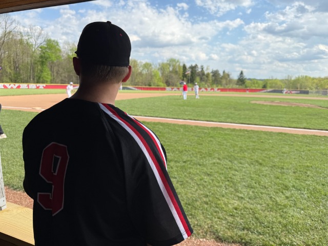 Caeleb Snyder surveys the Northwest Indians during warmups