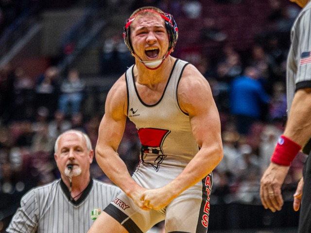 Chance Schlauch celebrating after he pins his opponent for a 3rd place finish.