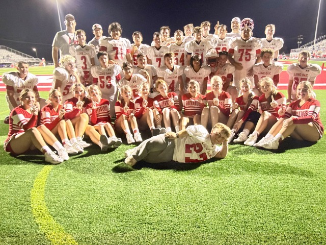 LOMS 7th Grade football team posing after winning the district