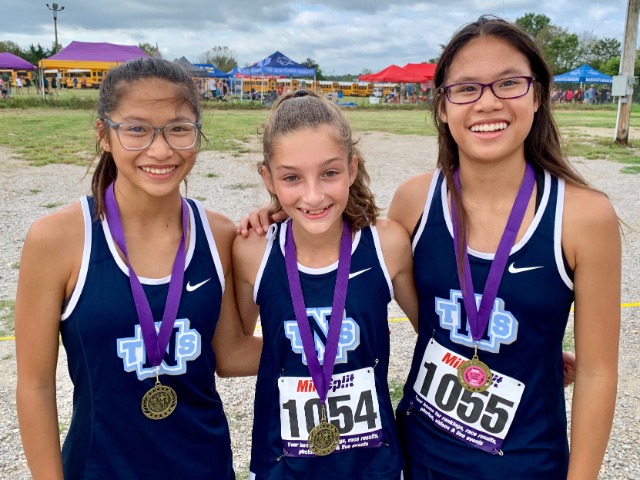Junior Girls pick up first ever cross country top finisher medals for TNS girls