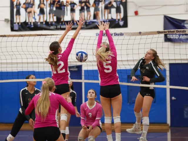 Mikayla Meyer and Emily Spence at the net, blocking a Whitney shot