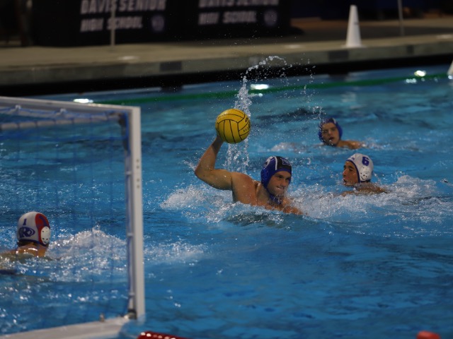 Junior Will Cutler looks to pass the ball as a few seconds remain on the shot clock