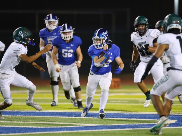 Noah Wittenberg runs through the River Valley defense for a first down.