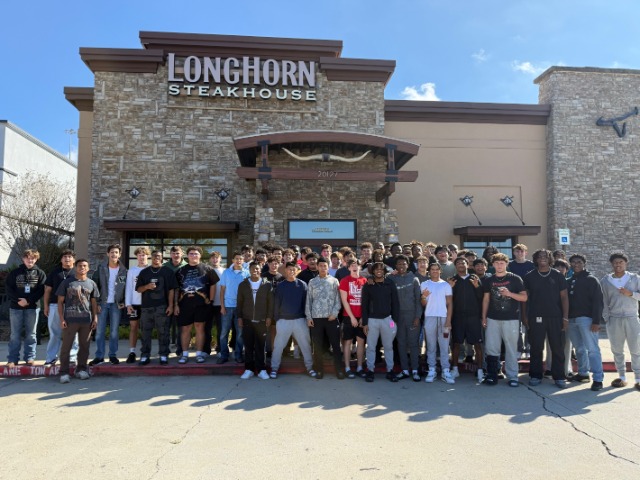 Varsity football team at the end of season luncheon 