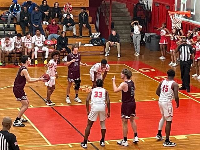 Dragons and Red Devils Split in District 15-AAAA Basketball Contests