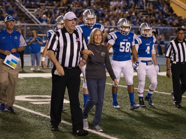 Escort To The Coin Toss