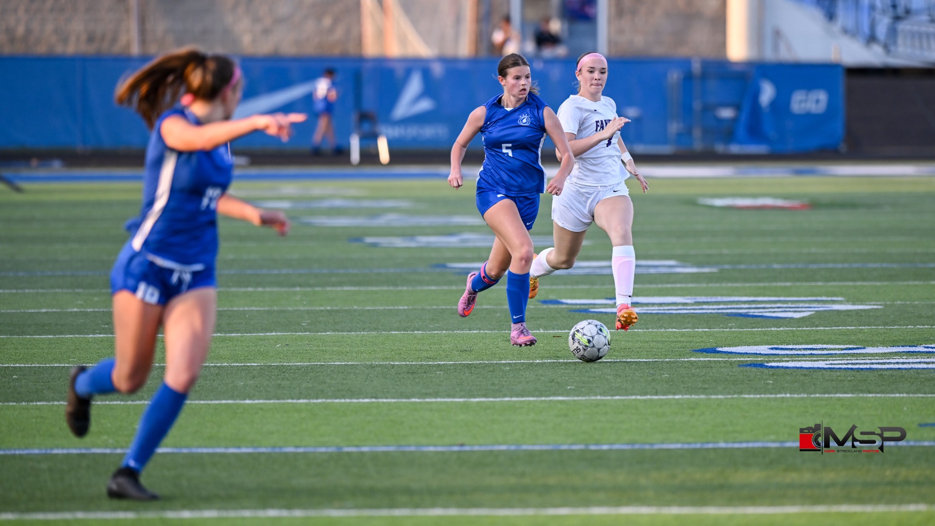 Slide 3 - Cate Jackson driving for the goal!