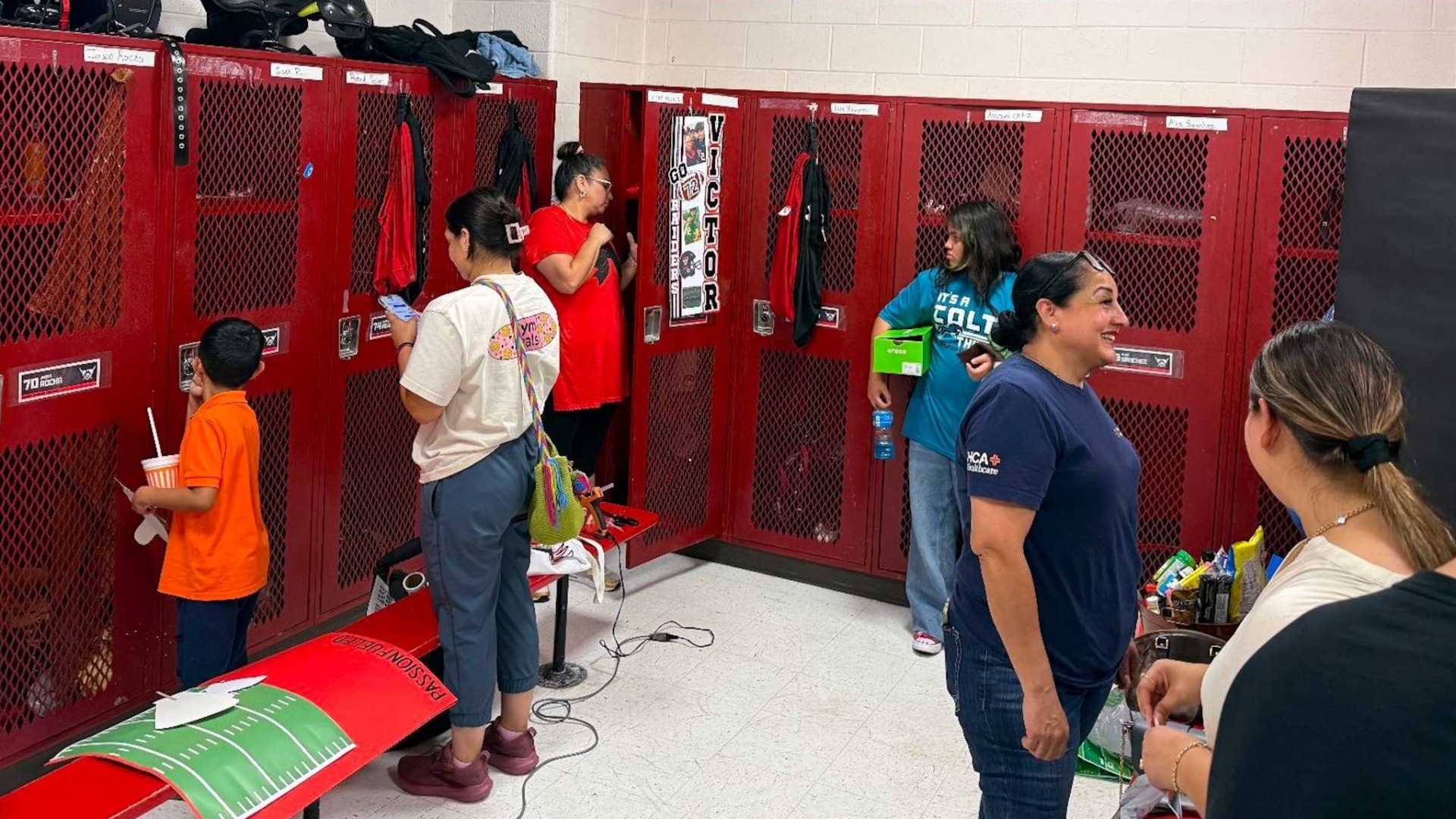 Slide 9 - PHOTOS: RAIDER FOOTBALL FAMILY DECORATES LOCKER ROOM FOR SEASON OPENER