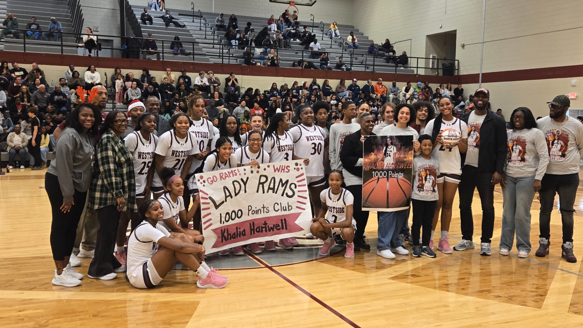 Slide 2 - Khalia Hartwell 1000 Points in  Career