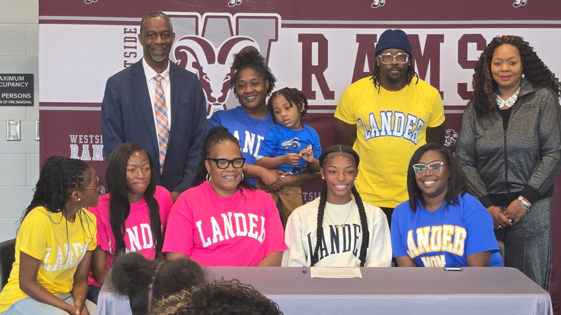 Slide 4 - JANILAH RHODES SIGNS WITH LANDER TRACK
