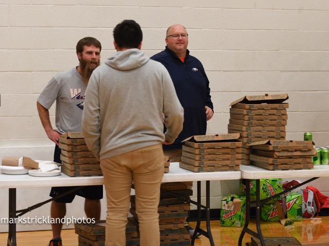 Serving Pizza to the student section for Basketball Game 1.25.19