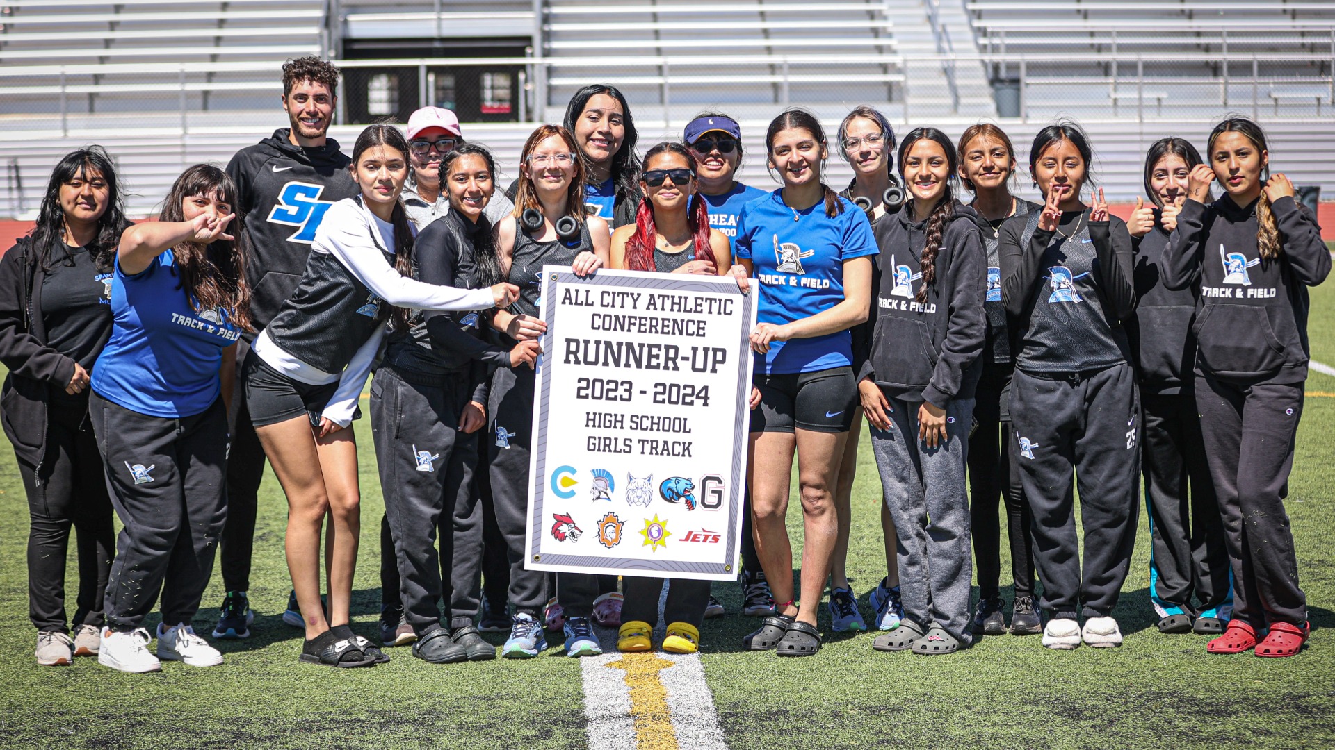 Slide 3 - Lady Spartans Receive 2024 ACAC Track & Field Runner-Up Banner
