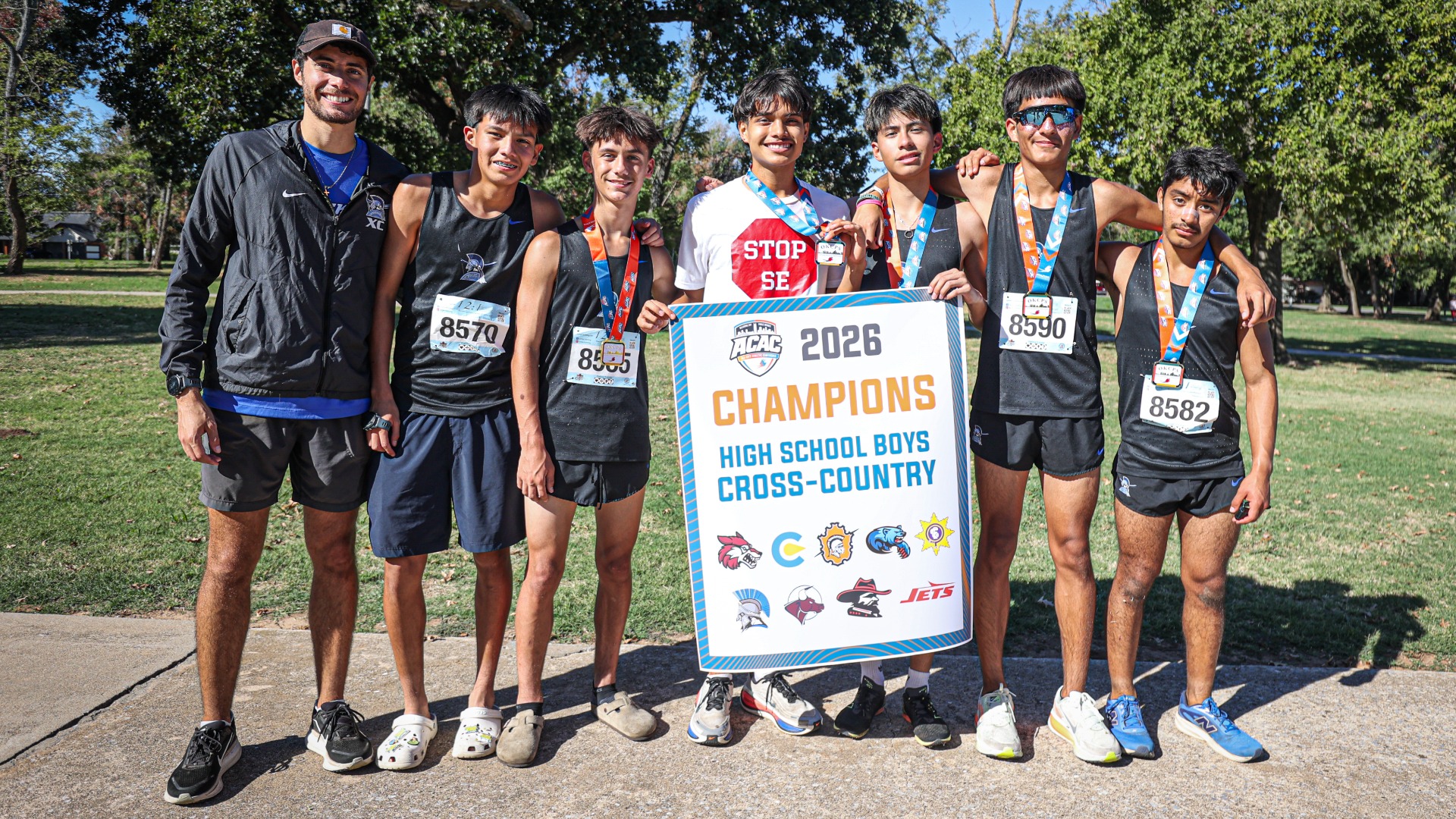 Slide 1 - Spartans Claim 2026 ACAC High School Boys Cross-Country Championship Banner