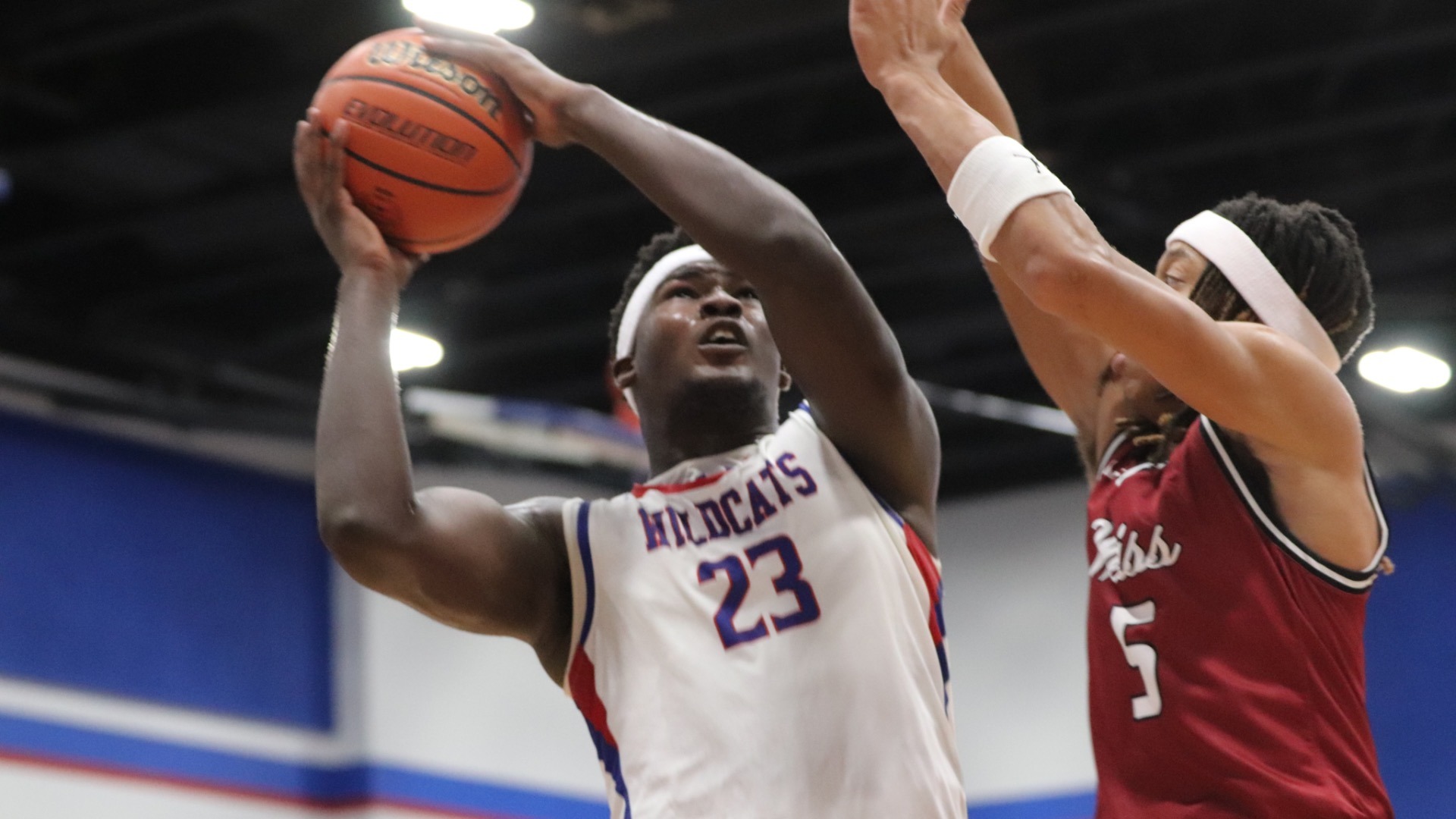 Slide 0 - Wildcats take down Weiss 75-63