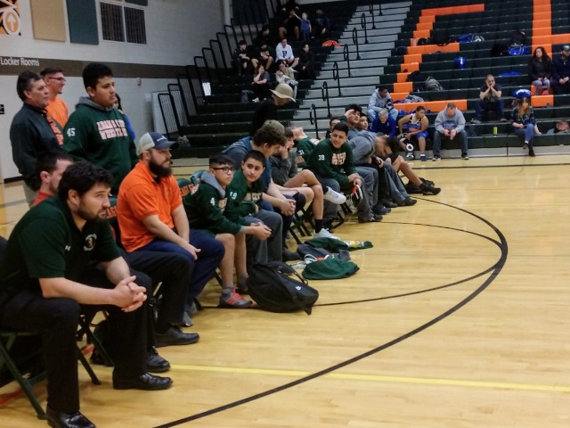 Coaches and Teammates engaged in the match
