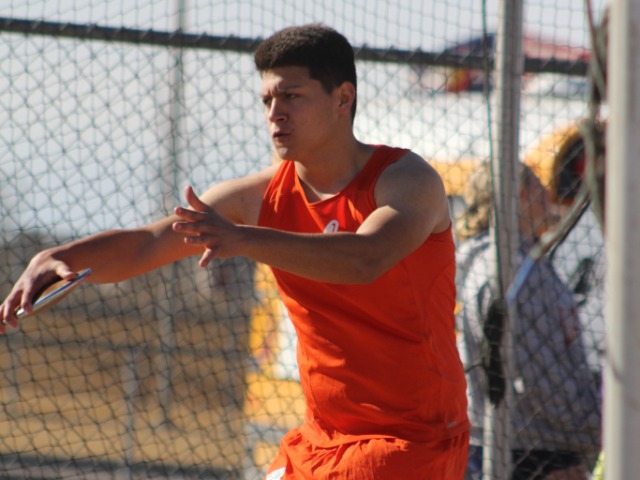 Adams City’s Francisco Rodriguez prepares to let the discus set sail during the Thornton Early Bird Invitational March 10 at Mountain Range High School. He improved 5 feet in his first two throws of the competition and finished 20th. His best throw was 76 feet 2 ½ inches. The top girls finisher for the Eagles was Amia Medina. She was seventh in the 100-meter dash in a time of 14.02 seconds. Carlos Barrera took second in both the 200-meter dash (22.89) and the 400-meter run (53.16). Johnathon Meyers was fourth in the 400-meters (55.79) and fifth in the 800-meters with a time of 2:21.08. Photo by Steve Smith