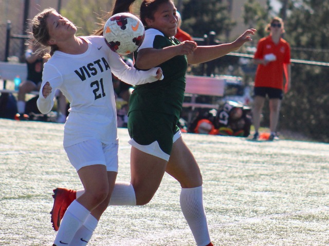 The loose ball seems to fall between Adams City’s Litzi DeLaRosa and Mountain Vista’s Ashleigh Willette during the first round of the state 5A girls soccer playoffs May 8 in Highlands Ranch