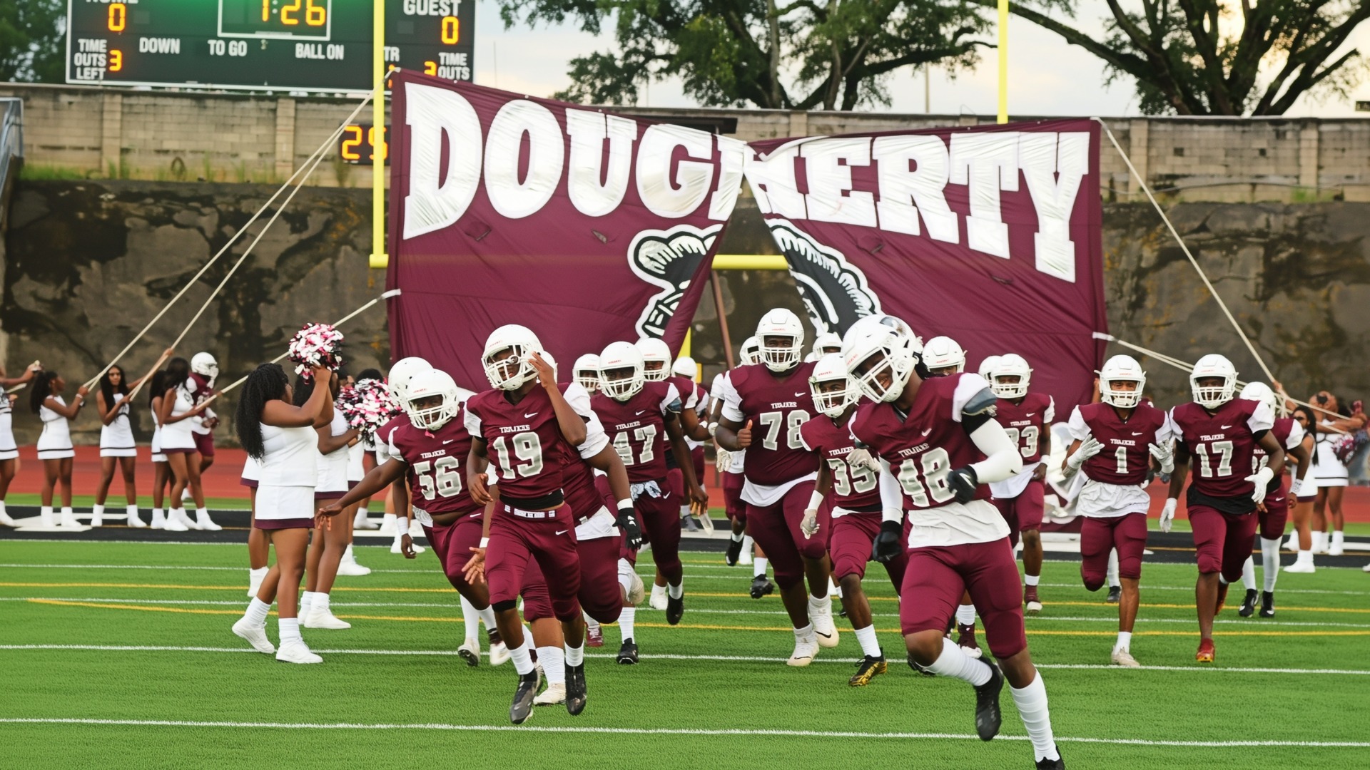 Football team running out onto the field