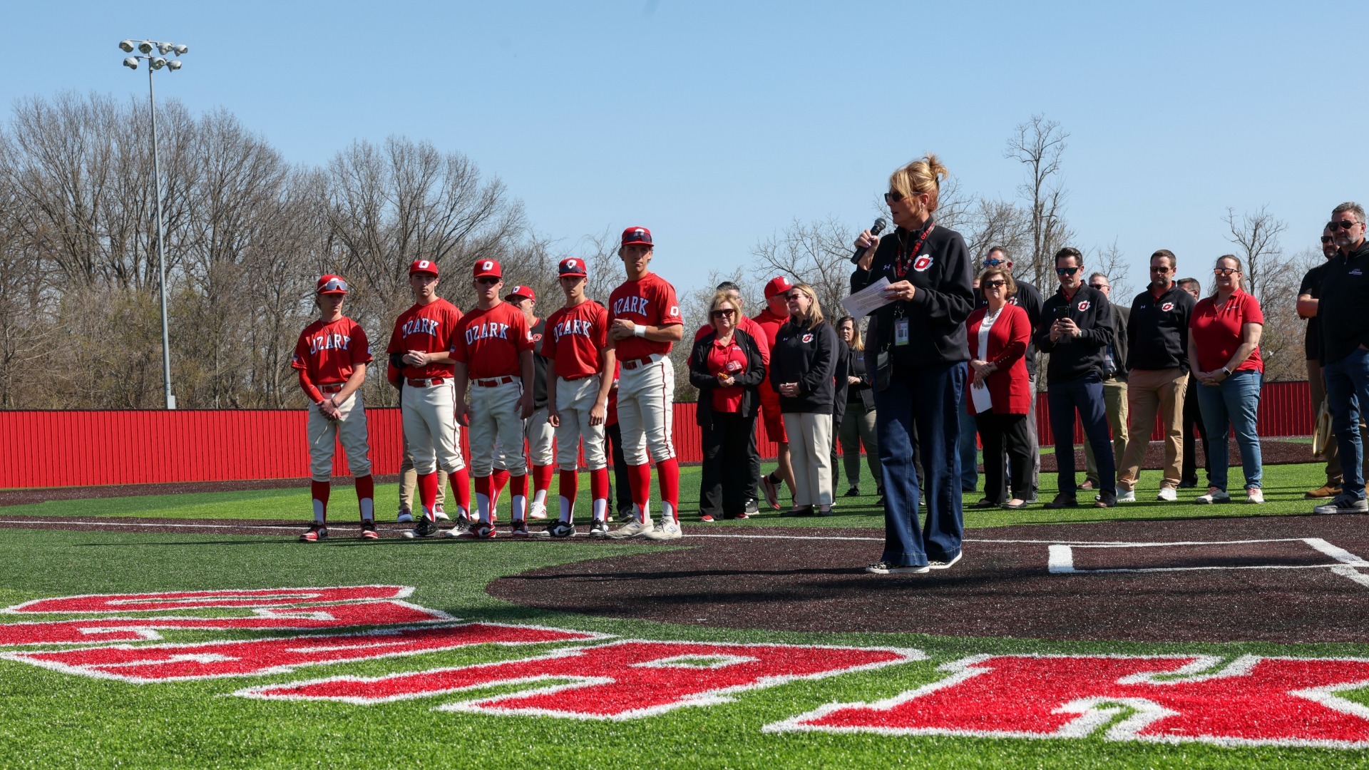 Slide 2 - Superintendent Dr. Lori Wilson speaks to the crowd at the Ribbon Cutting Ceremony for the new Mike Essick Baseball Field