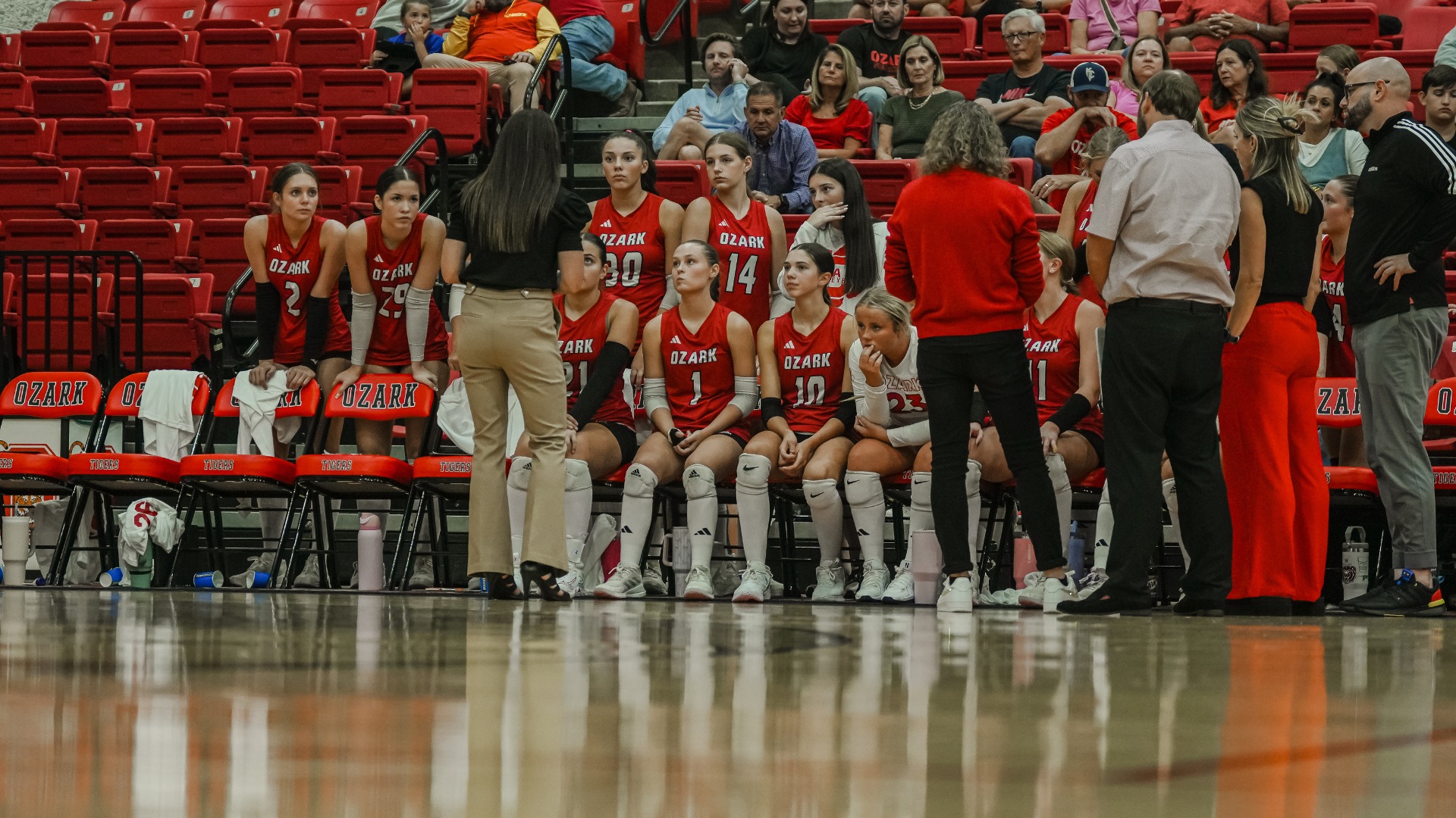 Ozark Varsity Volleyball during a timeout coming up with a game plan 