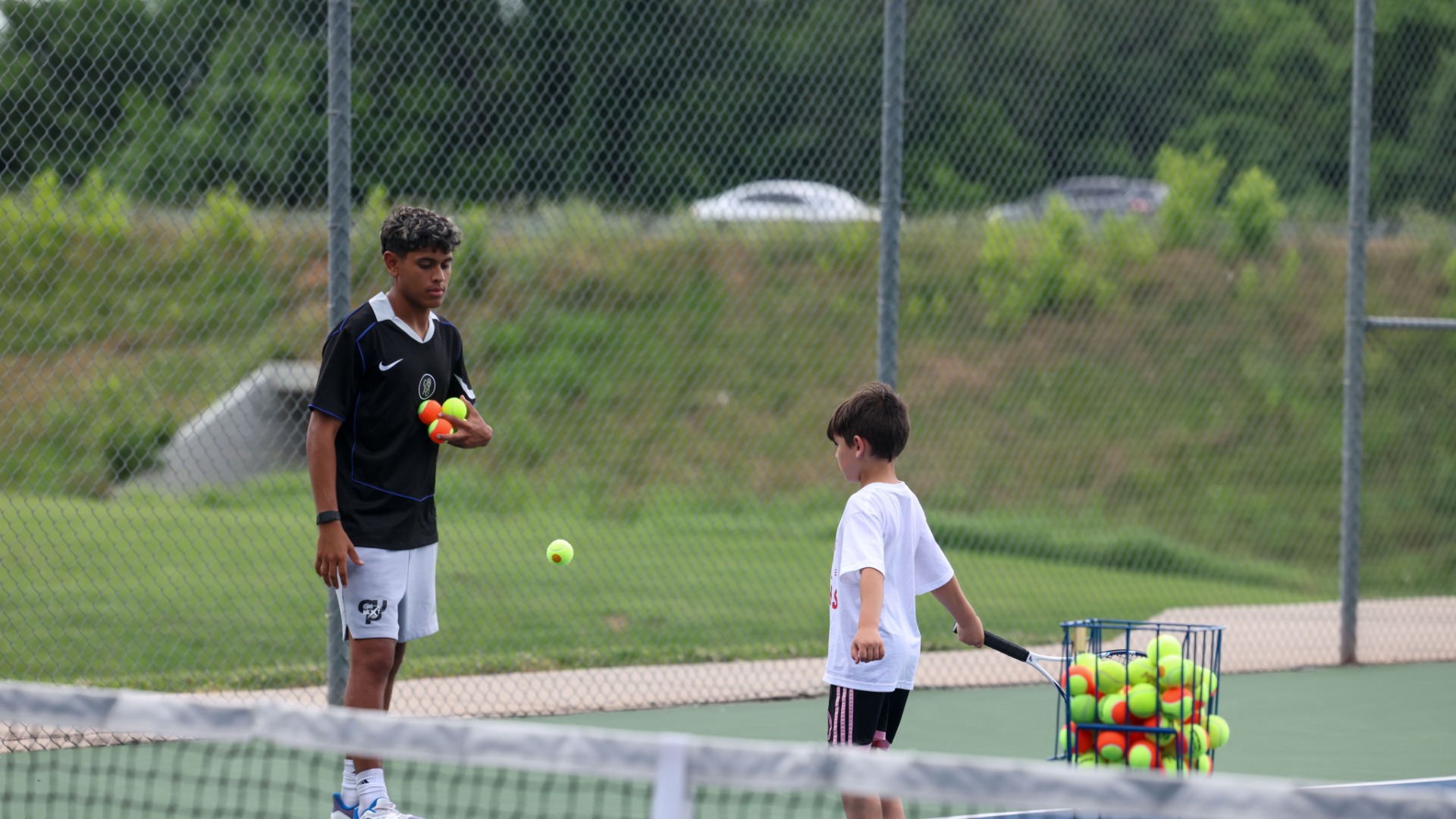 Slide 0 - Ozark Boys and Girls Tennis Hosts their summer youth camp