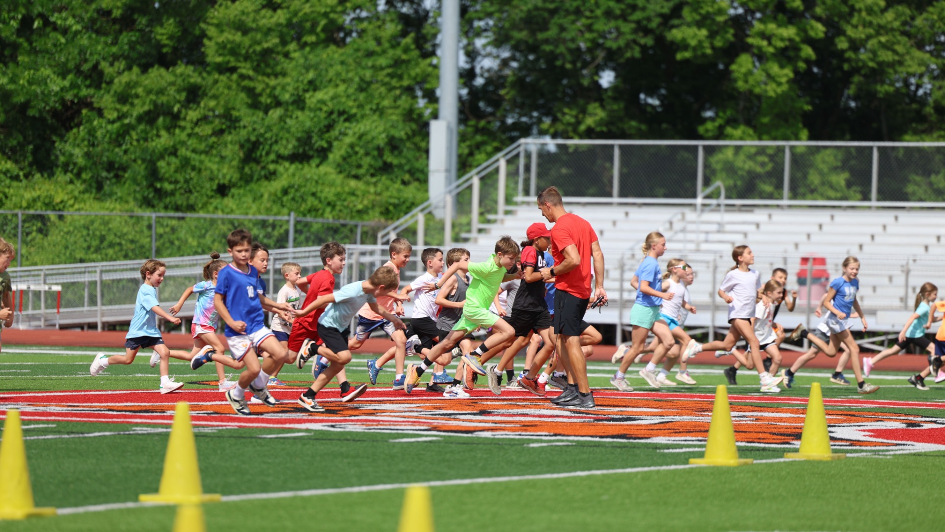 Slide 2 - Ozark Tigers Boys and Girls Track host their annual summer youth camp