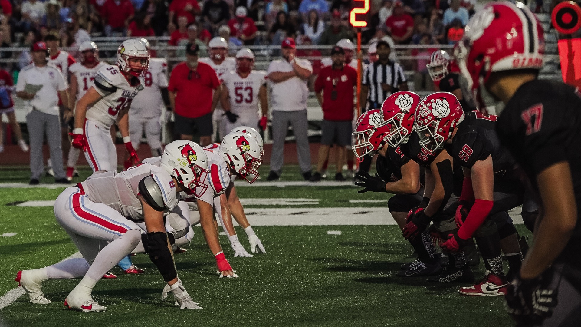 Ozark Football lining up to run a play against Webb City Defense