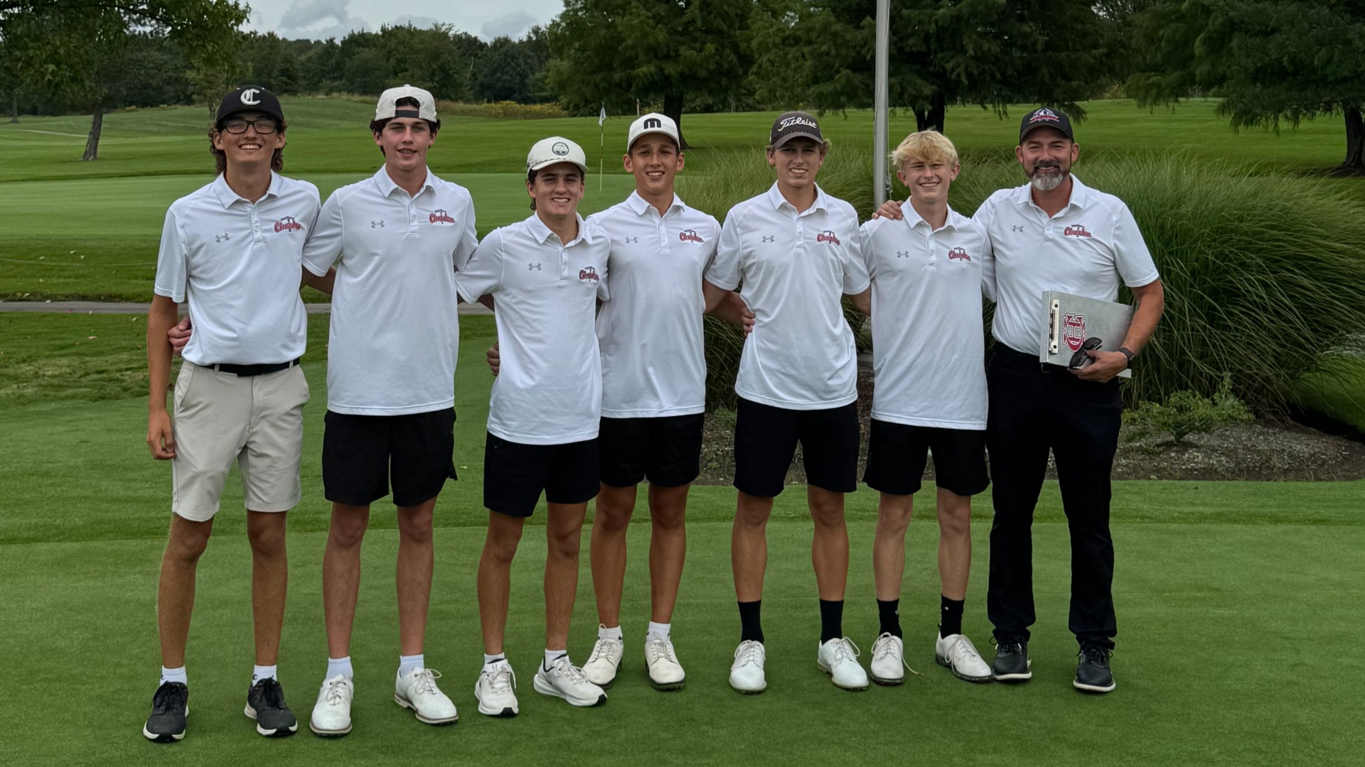 Boys Golf Athletes and Coach