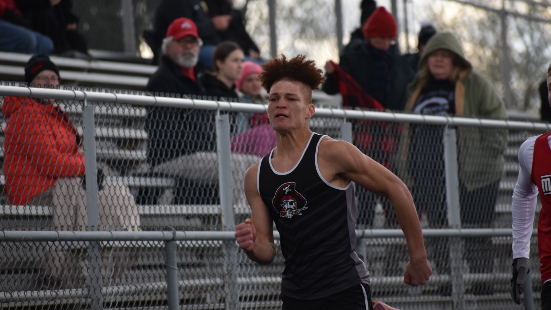 Student running a track sprint