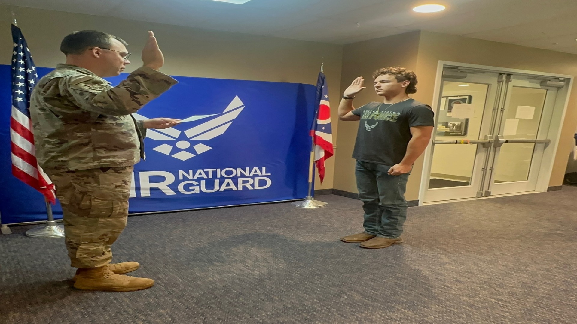 picture of Noah Wolny being sworn into the Air National Guard.