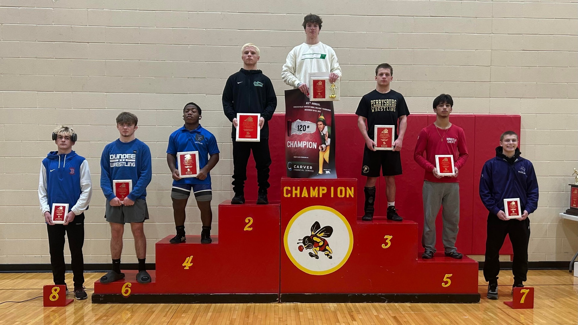 picture of wrestlers on a podium.