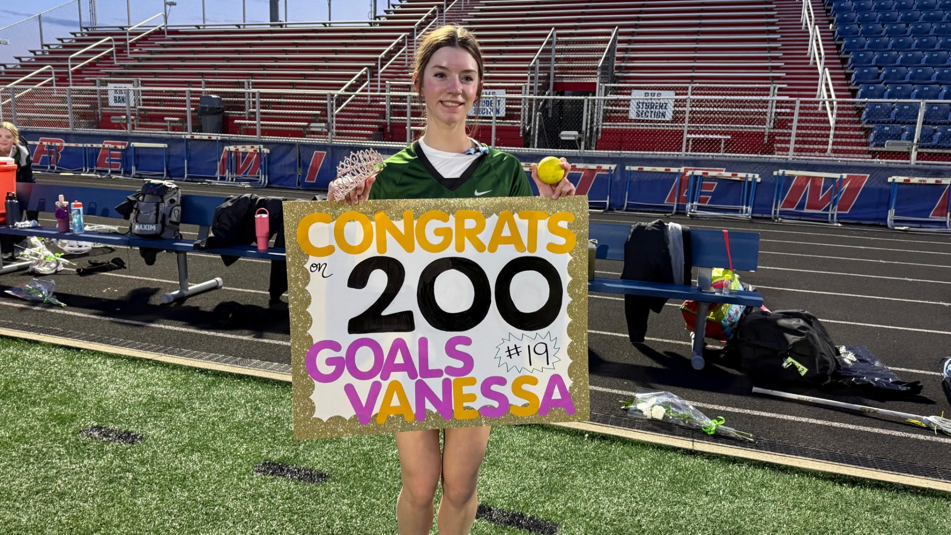 Picture of vanessa holding her 200 goal poster on 5- 7-2026